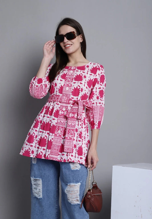Add a touch of playful elegance to your wardrobe with our Pink Cambric Printed Cotton Tops for Women. Embrace breezy comfort and chic style effortlessly. Elevate your look with a pop of color and a hint of charm